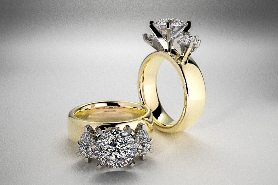 3 Stone Engagement Ring: Large 2 ct diamond with pear shaped accents.  Set in platinum on a 14k band.